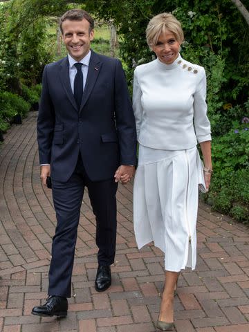 <p>Jack Hill - WPA Pool / Getty</p> Emmanuel Macron and Brigitte Macron attend a drinks reception for Queen Elizabeth II and G7 leaders at The Eden Project during the G7 Summit on June 11, 2021.