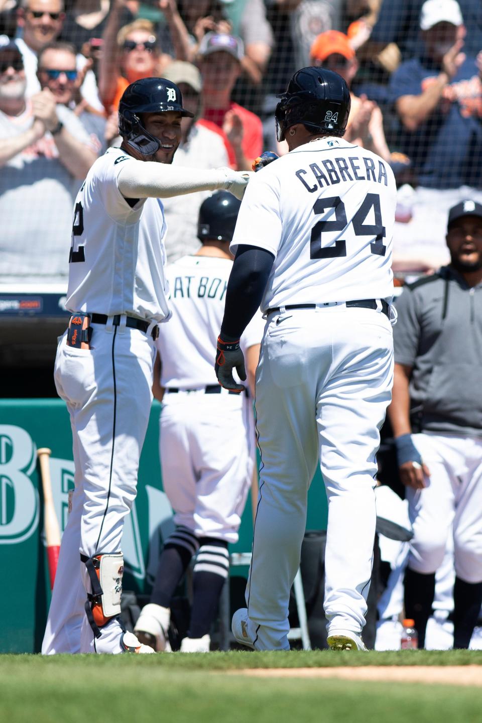 Tigers designated hitter Miguel Cabrera (24) is greeted by teammate Victor Reyes after hitting a solo home run in the second inning of a baseball game in Detroit, Sunday, May 15, 2022.