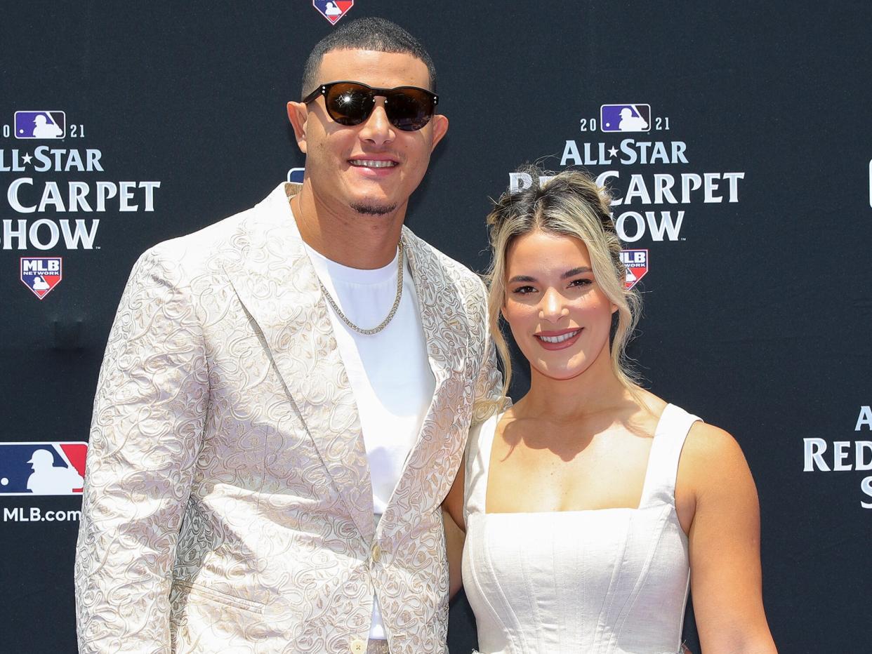 Manny Machado #13 of the San Diego Padres is seen with his wife, Yainee Alonso during the MLB All-Star Red Carpet Show at Downtown Colorado on Tuesday, July 13, 2021 in Denver, Colorado