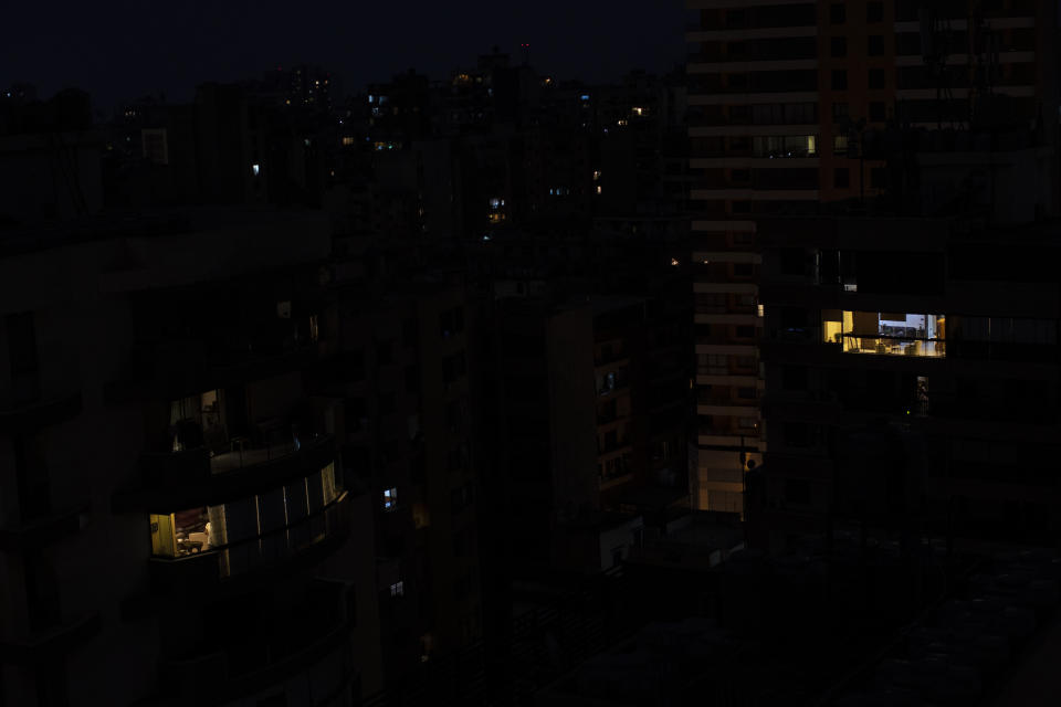 The capital city of Beirut remains in darkness during a power outage, Monday, July 6, 2020. The government in highly indebted Lebanon is in talks with the International Monetary Fund to secure financial assistance. But the talks have been bogged down by political divisions. Poverty and unemployment have been rising, only to be compounded by the economic restrictions imposed in effort to try to curb the spread of the coronavirus. (AP Photo/Hassan Ammar)