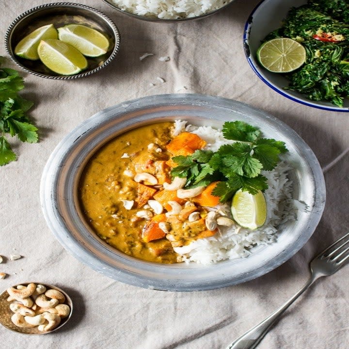 A bowl of pumpkin coconut curry with rice.