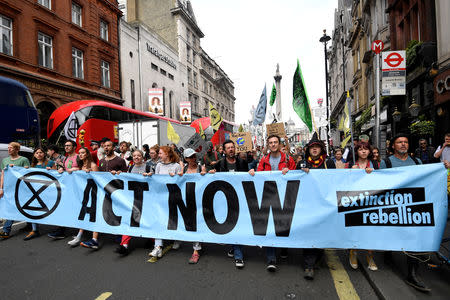 FILE PHOTO: Demonstrators march along Whitehall during an Extinction Rebellion protest in London, Britain April 23, 2019. REUTERS/Toby Melville/File Photo