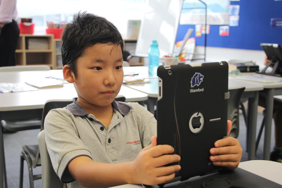 A student using an iPad at the Stamford American International School (Yahoo! photo)