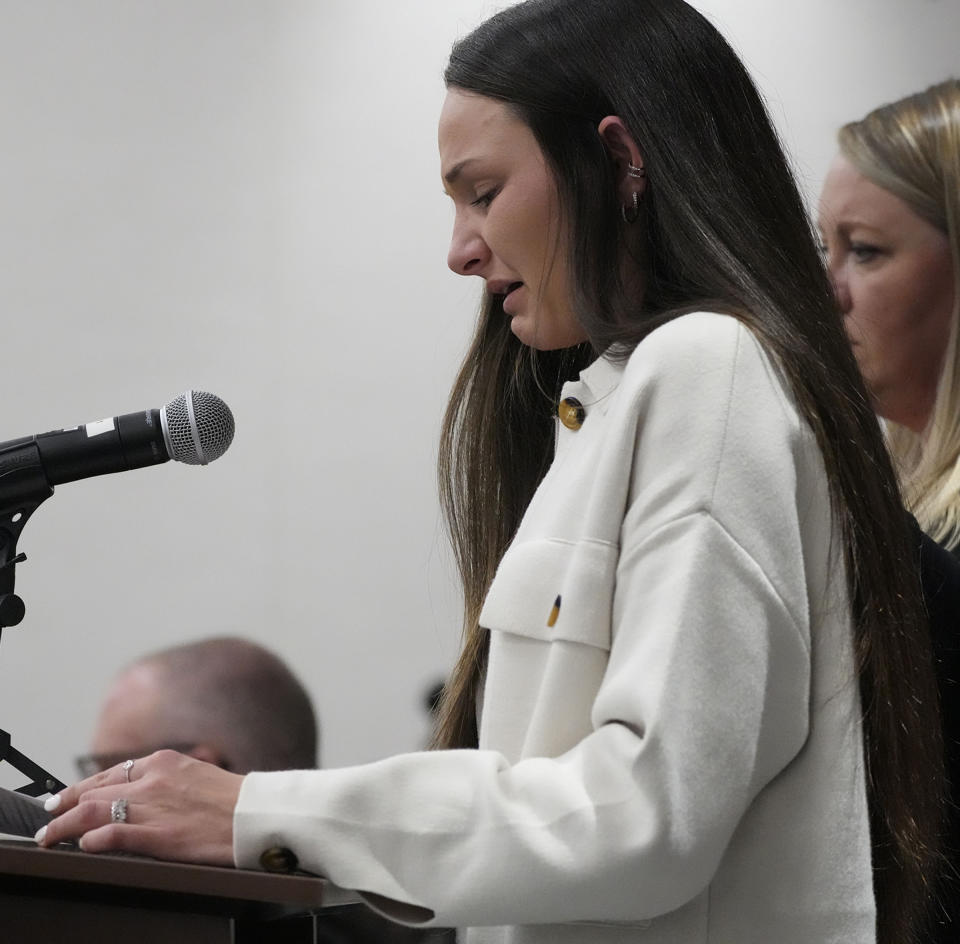 Alyssa Gajewski, 23, who was walking in the Waukesha Christmas Parade as a coach with the Xtreme Dance Team gives a victim statement during Darrell Brooks' sentencing in a Waukesha County Circuit Court in Waukesha, Wis., on Tuesday, Nov. 15, 2022. Dozens of people are expected to speak at the sentencing proceedings for Brooks, who was convicted of killing six people and injuring dozens more when he drove his SUV through a Christmas parade in Waukesha last year. (Mike De Sisti/Milwaukee Journal-Sentinel via AP, Pool)