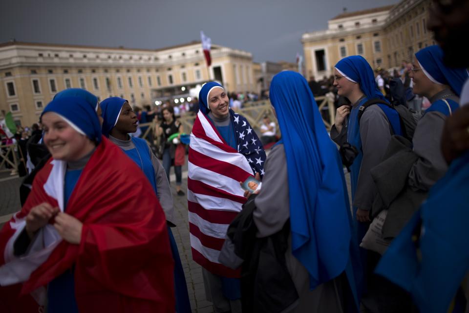 FILE - Nuns gather in St. Peter's Square at the Vatican, Saturday, April 26, 2014. Pilgrims and faithful gathered in Rome the day before Sunday's ceremony where Pope Francis elevated John XXIII and John Paul II to sainthood. (AP Photo/Emilio Morenatti, File)