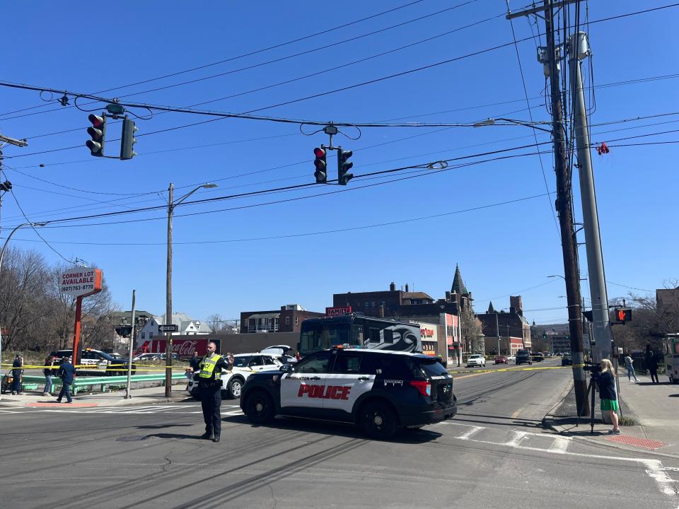 Binghamton Police direct traffic around a closed section of Main Street Tuesday afternoon following a reported physical altercation. A crash between an RV and SUV also occurred at the intersection.
