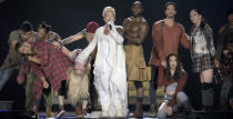 This image released by Amazon shows dinger Pink, center, performing with her dancers in a scene from her documentary, "Pink: All I Know So Far," debuting May 21 on Prime Video. (Amazon Content Services LLC via AP)