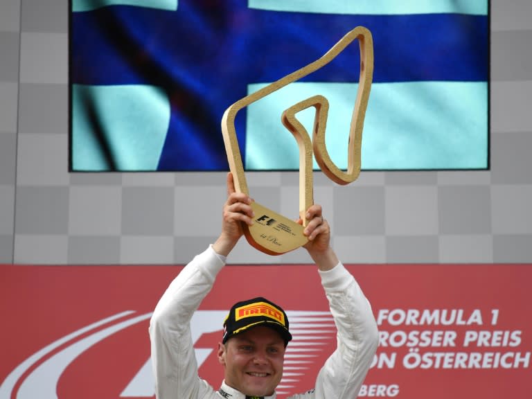 Mercedes driver Valtteri Bottas celebrates on the podium after winning the Austrian Grand Prix on July 9, 2017