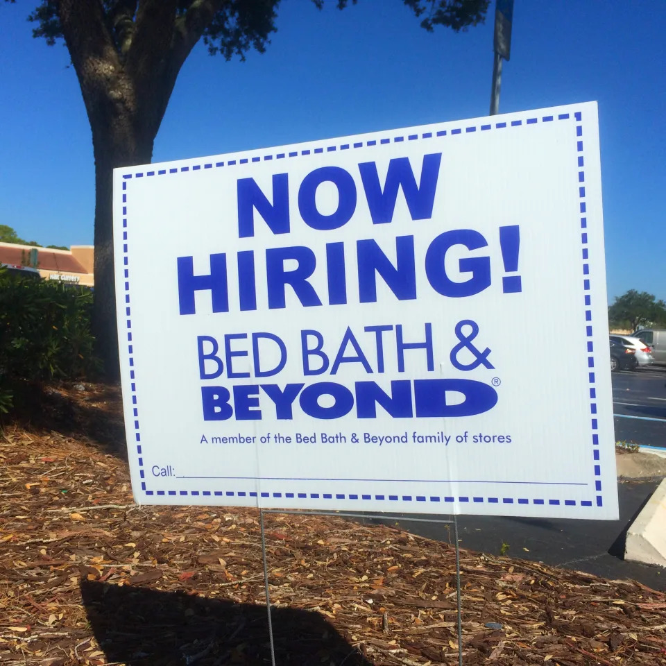 Now Hiring sign in the parking lot across from Bed, Bath And Beyond at Jacksonville Beach, Florida, USA on October 26, 2014.