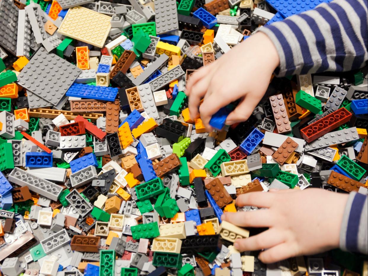 Lego manufactures around 100,000 tonnes of plastic blocks each year (Getty)