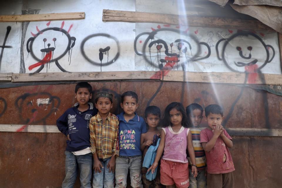 <div class="inline-image__caption"><p>Rohingya refugee children outside a tin-shack.</p></div> <div class="inline-image__credit">Bhat Burhan</div>