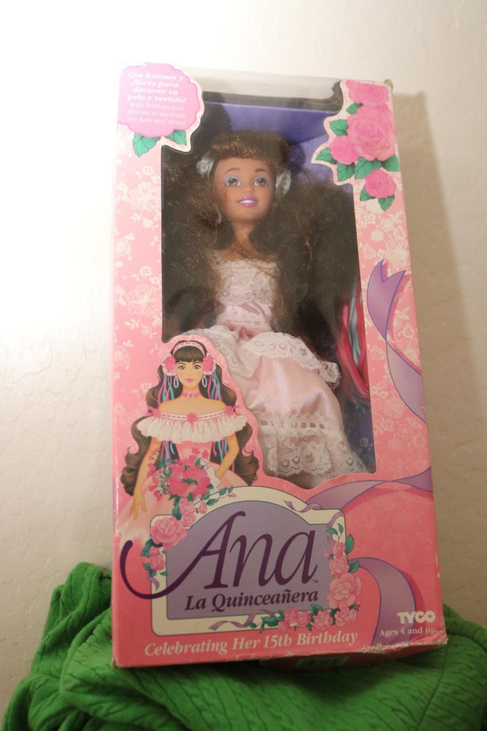An Ana La Quinceanera doll in her box