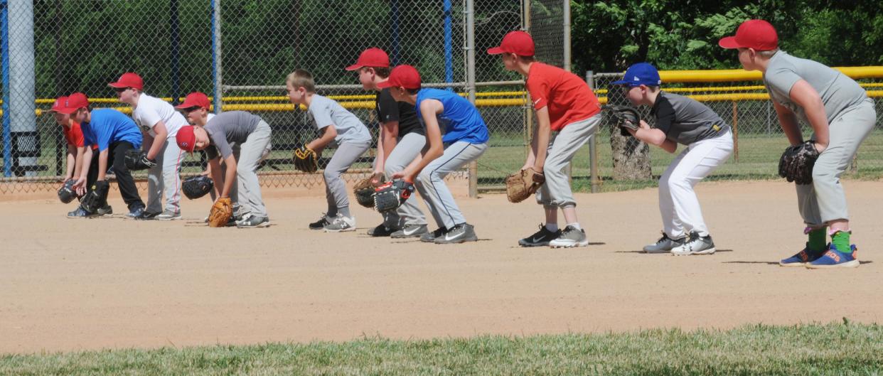 Members of the Salina Scrappers baseball team practice at one of the eight fields at Bill Burke Sports Complex in Salina. The fields will get improved artificial turf after the Salina City Commission approved a $1.7 million bid for the project.