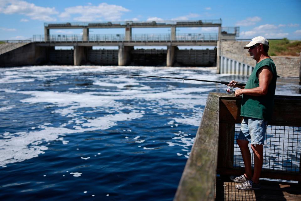 In this September photo, a Palatka man fishes at the Rodman Dam in Putnam County, near Palatka