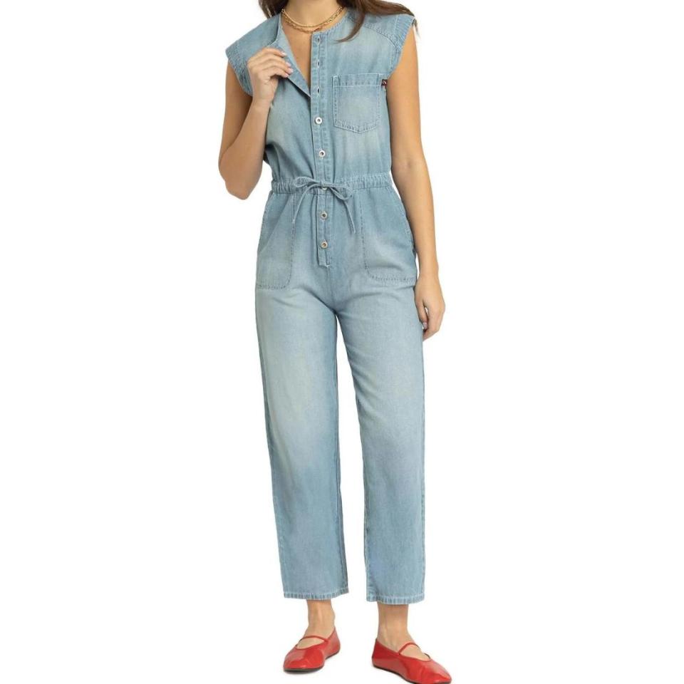 model wearing lightwash utility denim jumpsuit