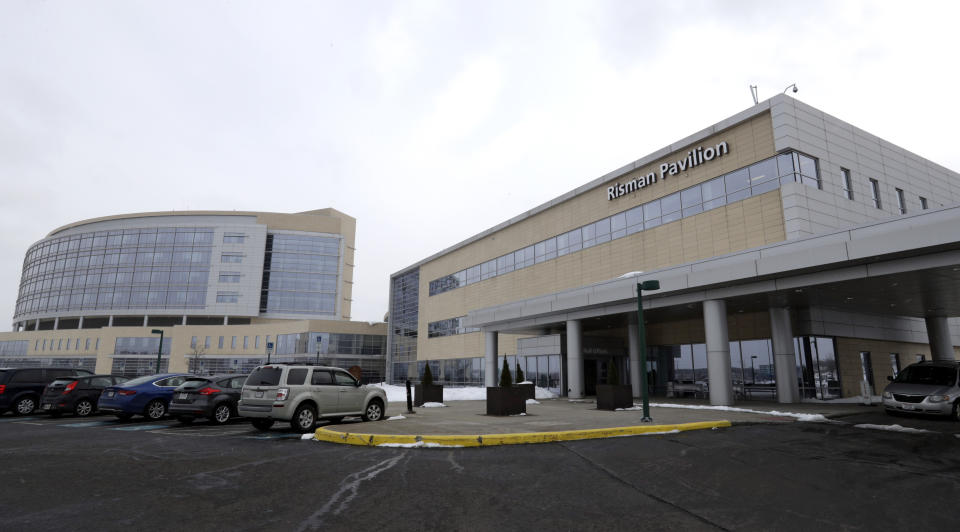 FILE - This Monday, March 12, 2018, file photo, shows the exterior of the University Hospital Ahuja Medical Center Kathy Risman Pavilion in Beachwood, Ohio. The former lab director at a fertility clinic where a malfunctioning storage tank destroyed thousands of frozen eggs and embryos in 2018 is blaming what he described as bungling staff and administrators who ignored his warnings. The claims made in legal filings in April 2021 have ignited a flurry of accusations between University Hospitals in Cleveland and its former employee and his attorney. (AP Photo/Tony Dejak, File)