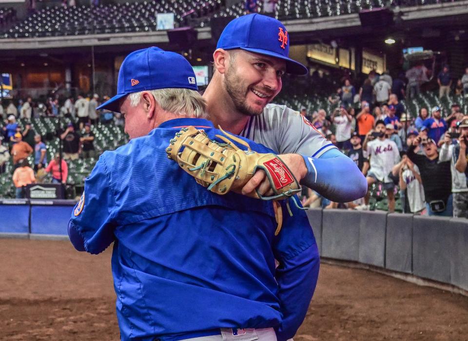 Mets first baseman Pete Alonso celebrates with manager Buck Showalter after clinching a playoff berth on Sept. 19.