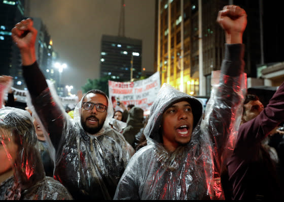 Demonstrators shout slogans against Brazilian President Michel Temer in Sao Paulo, Brazil, Thursday, May 18, 2017.