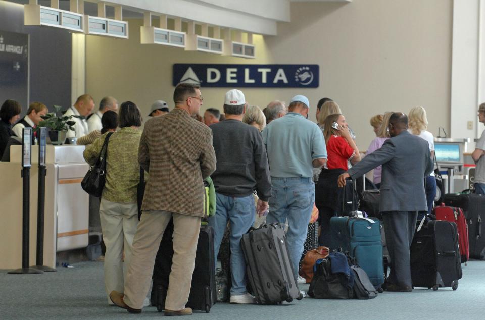 Travelers wait to check in at the Delta Airlines counter at the Savannah-Hilton Head Island International Airport. Savannah is one of the few airports of its size in the country that does not have an economy airline service.