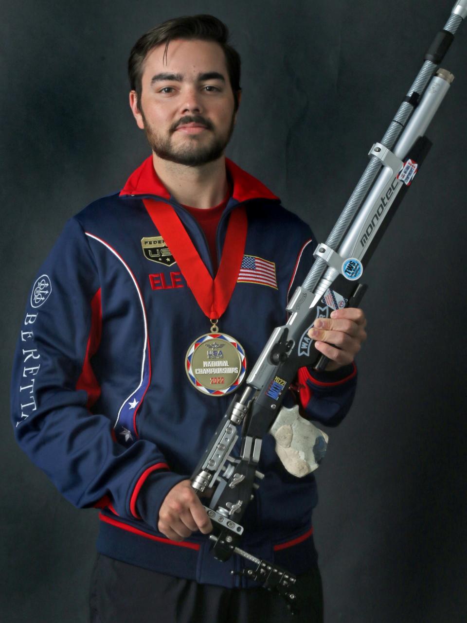 Medalist Ben Salas with his Walther LG 400 Monotec air rifle in studio Tuesday afternoon, July 26, 2022.