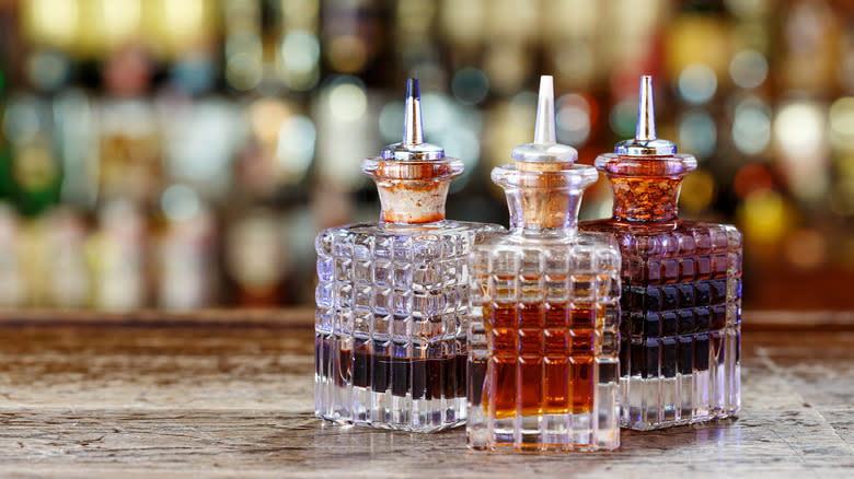 ornate bottles of bitters on bar