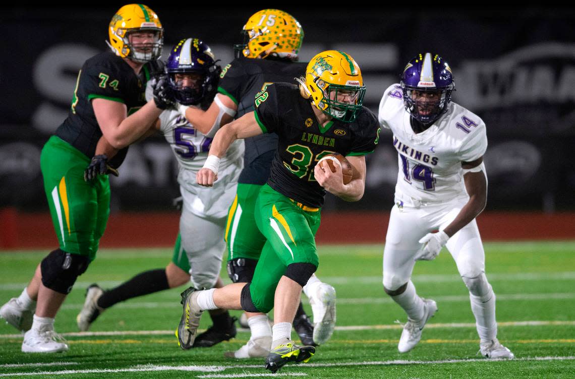 Lynden running back Lane Heeringa finds running room in the North Kitsap defense during the 2A football state championship game at Sparks Stadium in Puyallup, Washington, on Saturday, Dec. 3, 2022.