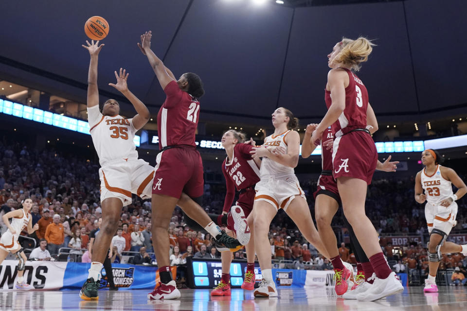 Texas forward Madison Booker (35) shoots over Alabama forward Essence Cody (21) during the first half of a second-round college basketball game in the women’s NCAA Tournament in Austin, Texas, Sunday, March 24, 2024. (AP Photo/Eric Gay)