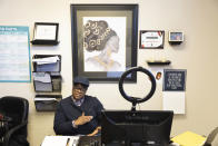 T.J. King, who is an outreach specialist with the Nebraska AIDS Project, is photographed in their office on Thursday, Feb. 23, 2023, in Lincoln, Neb. King came off probation in August after serving time for drug and theft convictions. King’s first chance to vote will be in the 2024 presidential election season -- unless a legislative proposal introduced in January that would remove the two-year requirement passes and becomes law. (AP Photo/Rebecca S. Gratz)