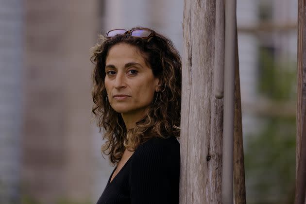 Emily Abramson, seen here in front of her home, didn't take her brother to the closest hospital because it no longer had an inpatient psychiatric wing.