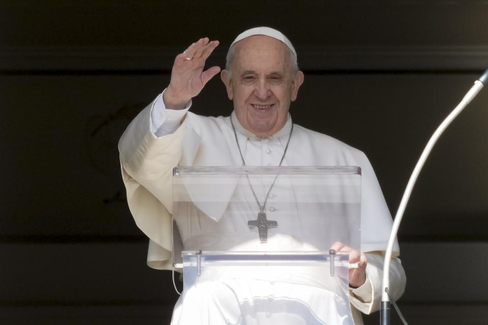 Pope Francis delivers his blessing as he recites the Angelus noon prayer from the window of his studio overlooking St.Peter's Square, at the Vatican, Sunday, Oct. 24, 2021. (AP Photo/Andrew Medichini)