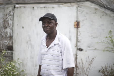 Morris Gbolo, 57, originally from Liberia, poses for a portrait on his 13-acre farm, where he grows African vegetables, in Vineland, New Jersey, October 9, 2015. REUTERS/Mark Makela