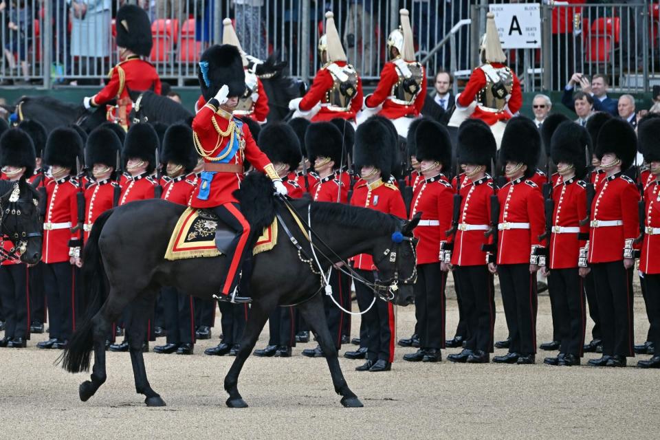 Britain's Prince William, Duke of Cambridge salutes as he rides a horse across the parade ground during the Colonel's Review at Horse Guards Parade in London on May 28, 2022. - The Colonel's Review is identical to Trooping the Colour, the Queen's annual birthday parade. (Photo by Ben Stansall / AFP) (Photo by BEN STANSALL/AFP via Getty Images)