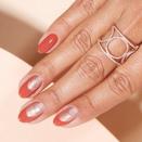 <a href="https://www.opi.com/nail-art/golden-gate-ridge#QPgdwsyaQbgDOiYs.97" rel="nofollow noopener" target="_blank" data-ylk="slk:This warm design;elm:context_link;itc:0;sec:content-canvas" class="link ">This warm design</a> exhibits a whole new take on gradient manicures. It starts with a solid pinky in OPI Infinite Shine polish in Yank My Doodle, a tawny terracotta, which rises as an arch higher and higher on its way to the thumb, supported by a growing ridge of the shimmering shade Worth a Pretty Penne. An expanding section of negative space adds an extra touch of chicness.