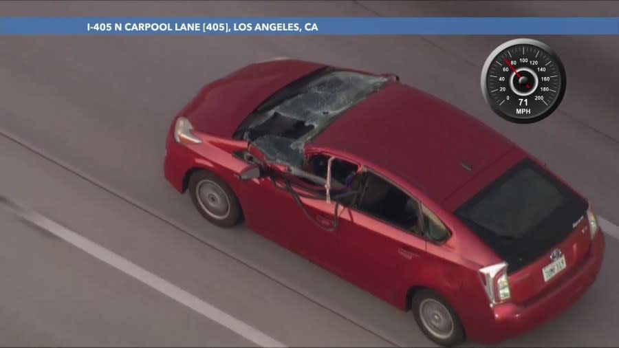 Major windshield and front-end damage is seen after a driver in a suspected stolen vehicle rammed a metal gate during a pursuit in the San Fernando Valley on July 4, 2024. (KTLA)