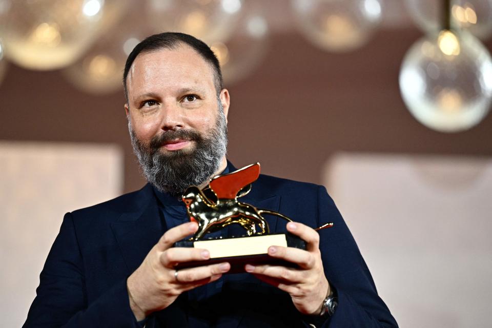 Director Yorgos Lanthimos poses with the Golden Lion prize, awarded for his film "Poor Things" at the 80th Venice Film Festival on Sept. 9, 2023.