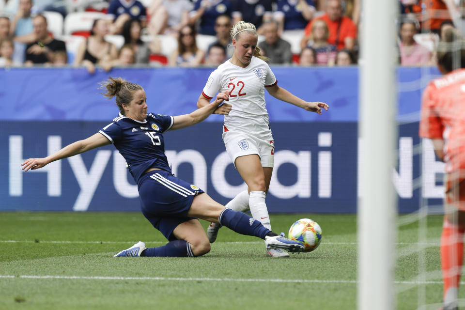 England's Beth Mead, right, and Scotland's Sophie Howard vie for the ball during the Women's World Cup Group D soccer match between England and Scotland in Nice, France, Sunday, June 9, 2019. (AP Photo/Claude Paris)