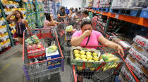 <p>Shoppers at Costco in Altamonte Springs, Fla., wait in line for the arrival of a shipment of water during preparations for the impending arrival of Hurricane Irma on Wednesday, Sept. 6, 2017. These residents waited in line starting at 7 a.m. for an 11 a.m. water delivery. (Photo: Joe Burbank/Orlando Sentinel/TNS via Getty Images) </p>