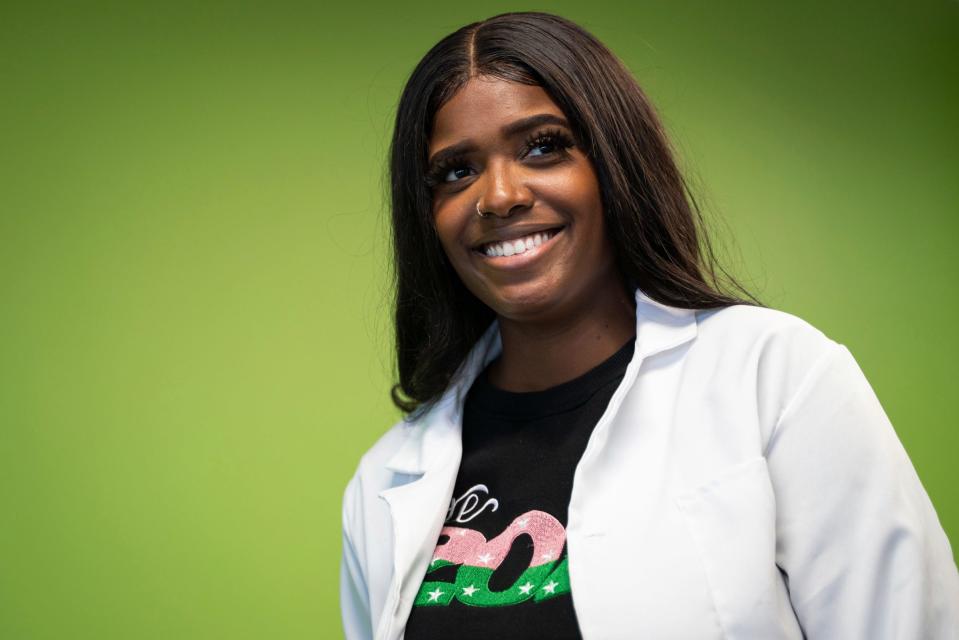 Alyssa Space, 29, lead chemist and founder of MySpaceLaboratories, leads a group of Girl Scouts in a science activity to create their own natural shampoo and conditioner at the Ford Resource and Engagement Center in Detroit, Saturday, Jan. 28, 2023. "I wanted to create a safe space for girls like you and share my passion," said Space, while speaking to the troop.