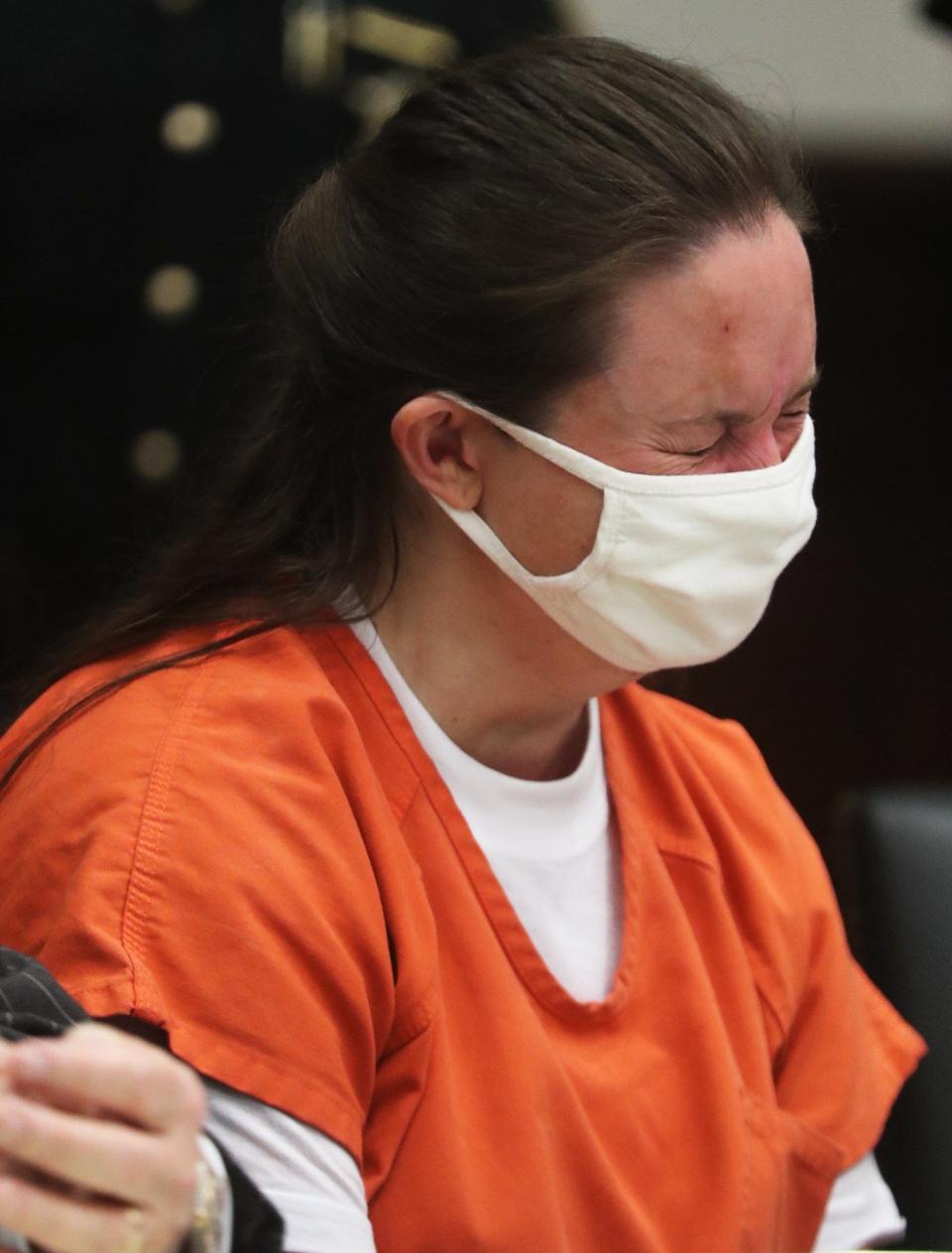 Erica Stefanko breaks down as she listens to family members speak during her sentencing in July 2021. Stefanko was sentenced to life in prison with possible parole after 30 years, but her conviction was later overturned. She will be retried starting Tuesday.