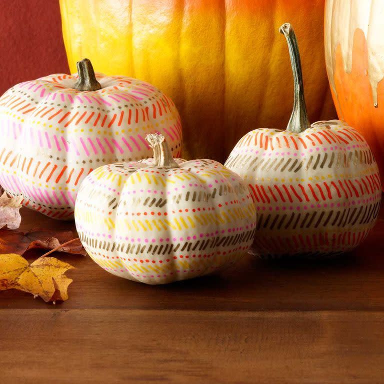 <p>Have an artsy side? Let it out by using paint pens to draw a fun design onto white pumpkins. </p><p><a class="link " href="https://www.amazon.com/Painting-Ceramic-Acrylic-Markers-Extra-fine/dp/B07485T22B?tag=syn-yahoo-20&ascsubtag=%5Bartid%7C10070.g.331%5Bsrc%7Cyahoo-us" rel="nofollow noopener" target="_blank" data-ylk="slk:SHOP PAINT PENS;elm:context_link;itc:0;sec:content-canvas">SHOP PAINT PENS</a> </p>