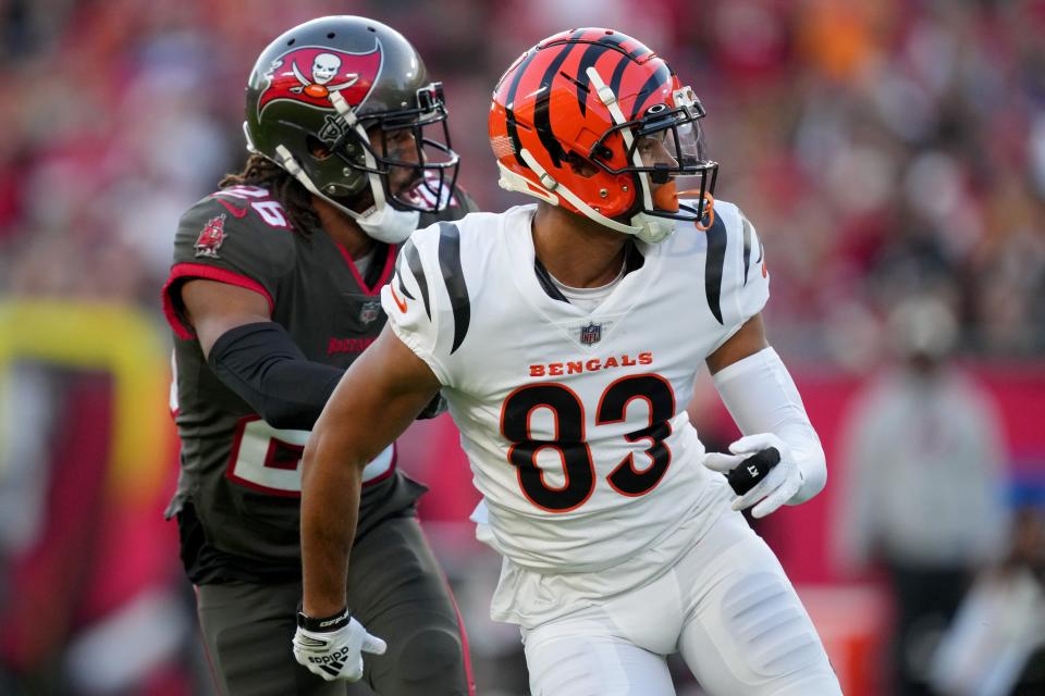 Cincinnati Bengals wide receiver Tyler Boyd (83) runs with a cast on his finger as Tampa Bay Buccaneers safety Logan Ryan (26) defends in the first quarter during a Week 15 NFL game, Sunday, Dec. 18, 2022, at Raymond James Stadium in Tampa, Fla. 