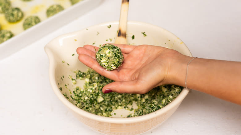 molded vegetarian quinoa ball in hand 