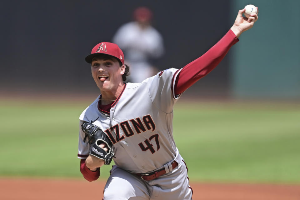 Arizona Diamondbacks starting pitcher Tommy Henry delivers during the first inning of a baseball game against the Cleveland Guardians, Wednesday Aug. 3, 2022, in Cleveland. (AP Photo/David Dermer)