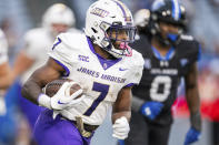 James Madison running back Ty Son Lawton (7) rushes for a first down in the second half of an NCAA college football game against Georgia State, Saturday, Nov. 4 2023, in Atlanta. (AP Photo/Hakim Wright Sr.)