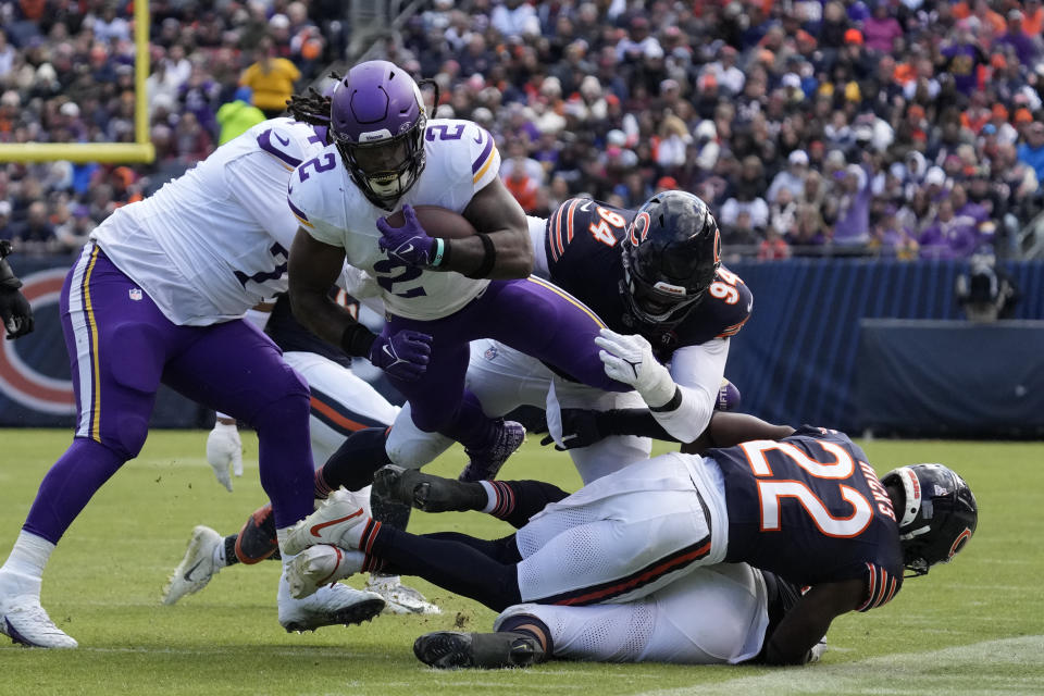 Minnesota Vikings running back Alexander Mattison (2) is tackled by Minnesota Vikings defensive end Dean Lowry (94) during the second half of an NFL football game, Sunday, Oct. 15, 2023, in Chicago. (AP Photo/Nam Y. Huh)