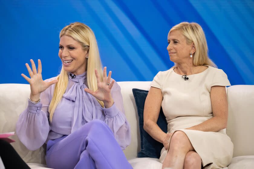 Today show contributor Jill Martin is dressed in purple and is sitting alongside Dr. Elisa Port who is wearing white