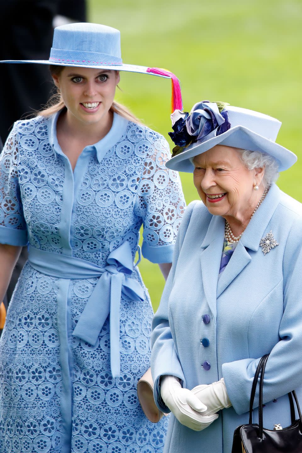 <p>Queen Elizabeth coordinates with granddaughter Princess Beatrice in a baby blue ensemble. </p>