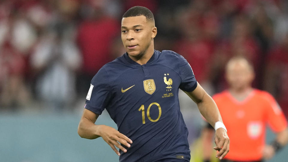 France's Kylian Mbappe in action during the World Cup group D soccer match between Tunisia and France at the Education City Stadium in Al Rayyan, Qatar, Wednesday, Nov. 30, 2022. (AP Photo/Frank Augstein)