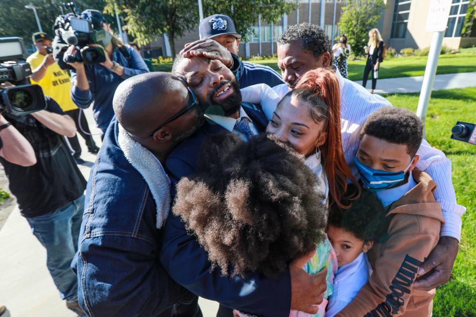 Juwan Deering is freed Sept. 30, 2021. He embraces his daughter Deja Deering-Poole and family outside of Oakland County Circuit Court in Pontiac.