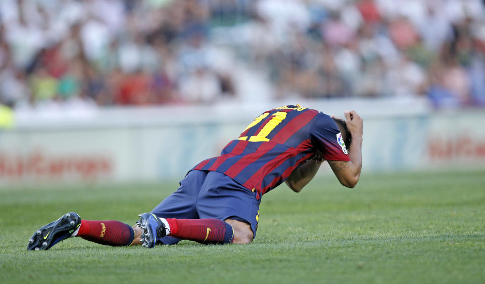 Barcelona's Adriano Correia from Brazil reacts after failing to score against Elche during a Spanish La Liga soccer match at the Martinez Valero stadium in Elche, Spain, on Sunday, May 11, 2014. (AP Photo/Alberto Saiz)